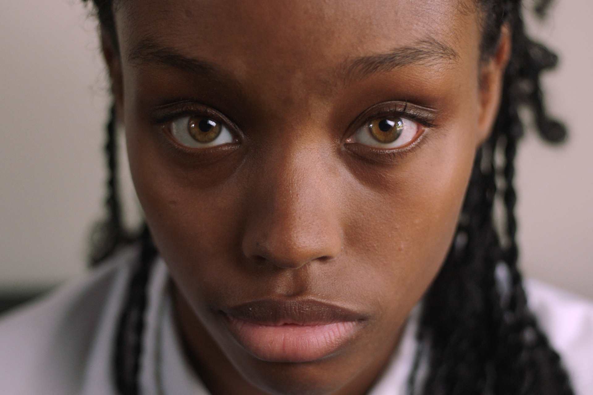End The Wait Campaign - Close-up of a teenage girl looking at the camera