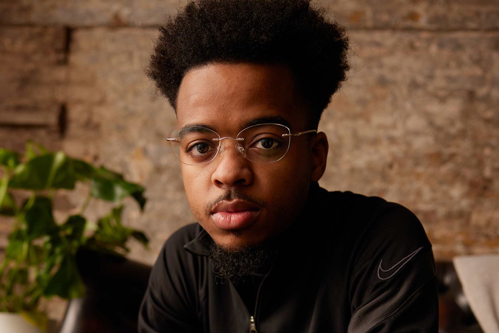 A young person looking directly at the camera.