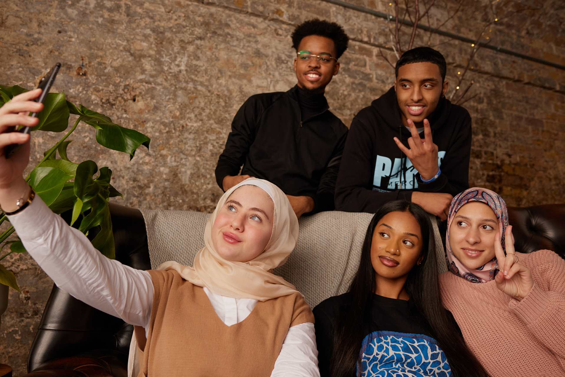 A group of people taking a selfie.