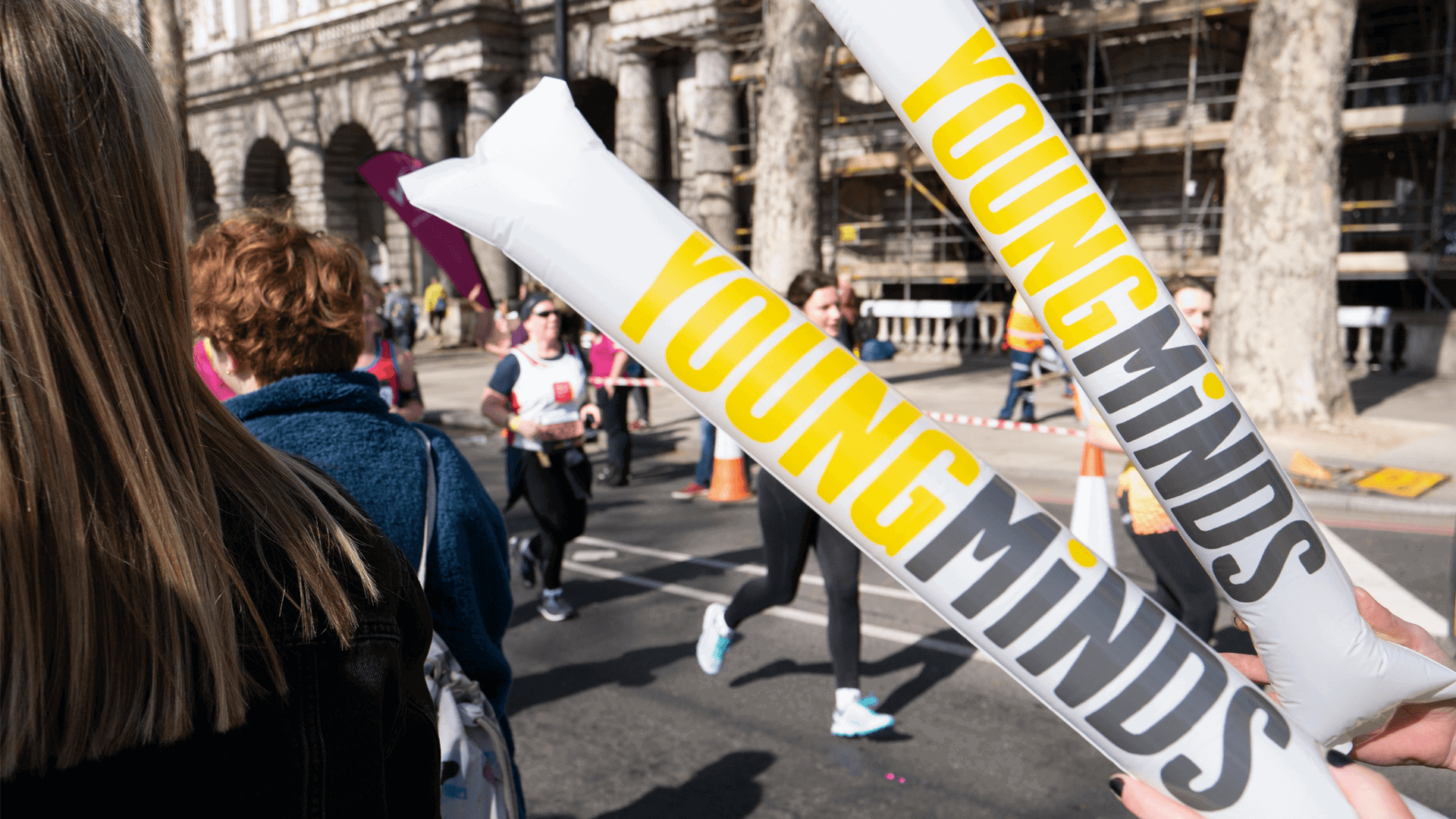 YoungMinds cheering sticks during a running event